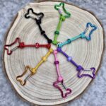 Kotbeutelhalter Knochenkarabiner